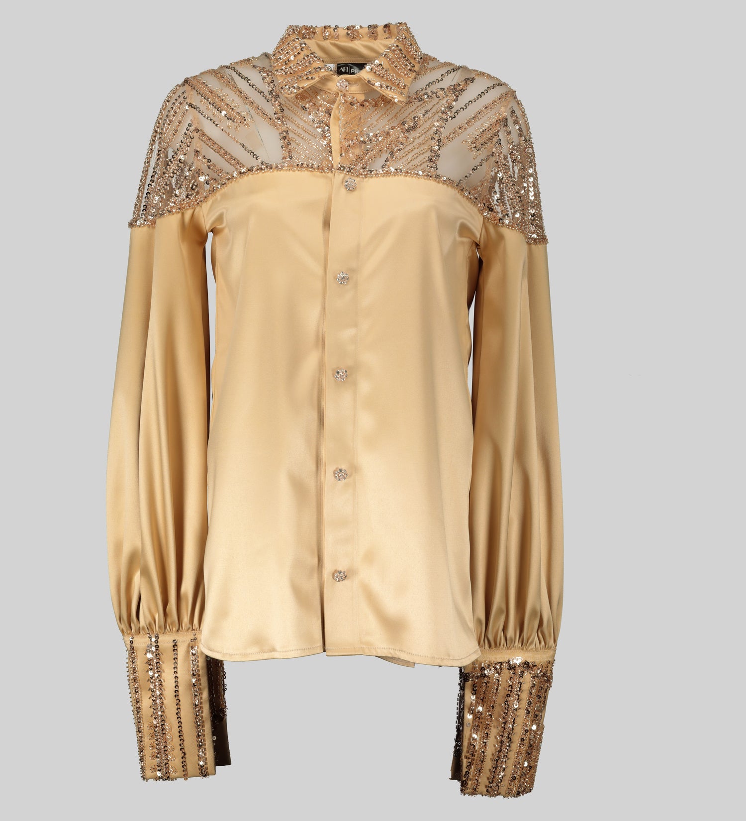 uxurious champagne-colored blouse with intricate beading details on the bodice. The blouse has a delicate lace overlay and a flattering silhouette. (Available at House of Nala)