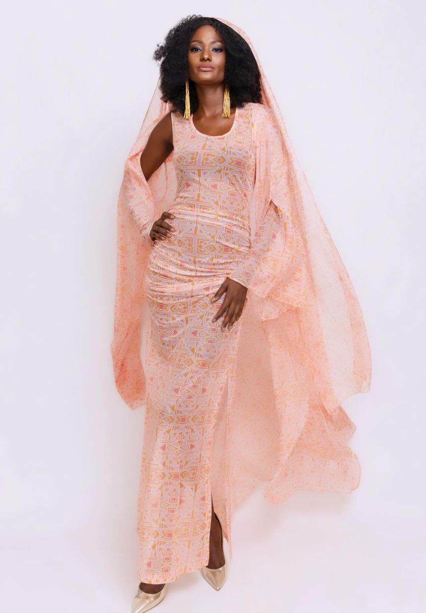 Peach Fuzz Dress by Alia Baré worn by model with matching cape