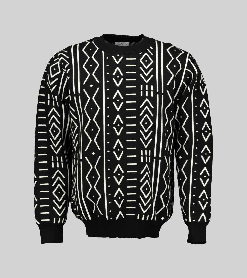 Black and white African print knit sweater with a boxy fit and long sleeves. The sweater features a warrior belt design in the centre.