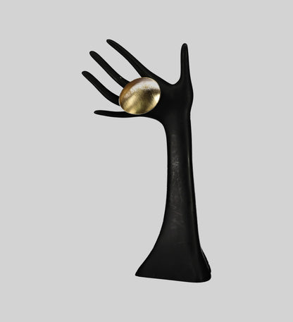 Ditsala Designs gold circular ring on a black hand mannequin