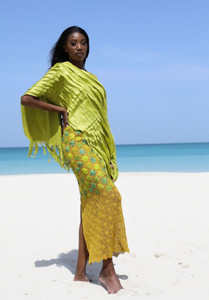 Green Knitted Dress by Eric Raisina with Silk Green Scarf worn by model on the beach