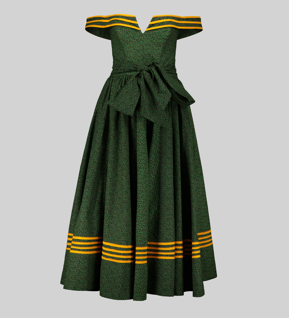 Green, yellow, and black shweshwe off-shoulder dress with flared skirt and mustard detailing.